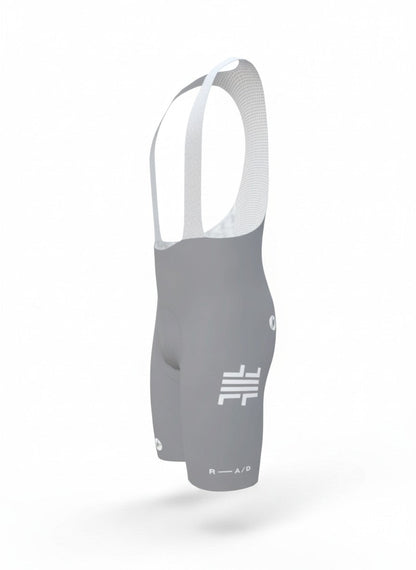 False Flat x Castelli Free Aero Race S bib shorts in cool grey with white branding and breathable mesh suspenders